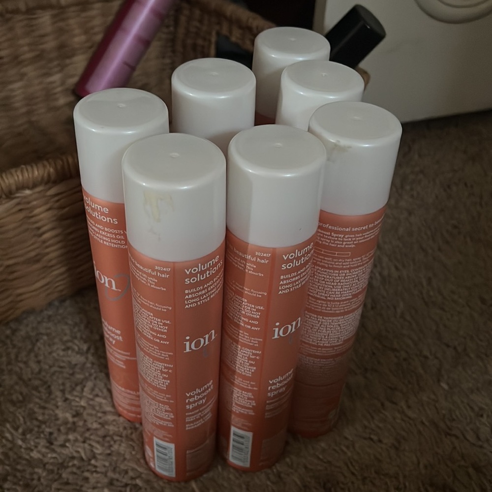 Three cans of iOn volume reboost spray